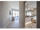 Bright hallway featuring a view into a modern bathroom with designer tile floors at 37200 N Cave Creek Rd # 1045, Scottsdale, AZ 85262