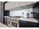 Close-up of kitchen featuring stainless steel stove and range hood at 37200 N Cave Creek Rd # 1045, Scottsdale, AZ 85262