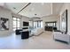 Spacious open-concept living room with fireplace and large windows at 37200 N Cave Creek Rd # 1045, Scottsdale, AZ 85262