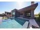 Modern home features a luxurious pool, patio area, and outdoor bar at 37200 N Cave Creek Rd # 1045, Scottsdale, AZ 85262