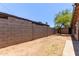 Fenced backyard with block wall for privacy and ample space for outdoor activities and landscaping at 3722 W Hadley St, Phoenix, AZ 85009