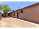 Private backyard showcasing a block wall, a secure gate, and plenty of space for landscaping and recreation at 3722 W Hadley St, Phoenix, AZ 85009