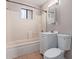 Bathroom featuring a tub, shower, vanity, mirror and toilet at 3722 W Hadley St, Phoenix, AZ 85009