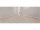 A bedroom with tile flooring and a neutral wall color. Bathroom access through door at 3722 W Hadley St, Phoenix, AZ 85009