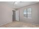 Bedroom with a neutral color palette and tiled floor at 3722 W Hadley St, Phoenix, AZ 85009