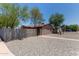 Charming home featuring gravel landscaping, a secure fence, and mature trees providing curb appeal at 3722 W Hadley St, Phoenix, AZ 85009