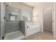 Large bathroom with walk in shower and separate tub at 4051 E Torrey Pines E Ln, Chandler, AZ 85249