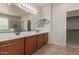 Large bathroom with double sinks, large mirror and walk in shower at 4051 E Torrey Pines E Ln, Chandler, AZ 85249