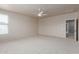 Large bedroom with carpet, ceiling fan and large window at 4051 E Torrey Pines E Ln, Chandler, AZ 85249
