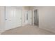 Carpeted bedroom featuring a closet and open door to the other spaces for easy navigation and extra storage at 4051 E Torrey Pines E Ln, Chandler, AZ 85249