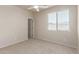Neutral bedroom featuring carpeted floor, a window, and a ceiling fan to provide a comfortable living space at 4051 E Torrey Pines E Ln, Chandler, AZ 85249
