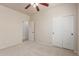 Carpeted bedroom featuring closet and open door to provide storage and an easy flow to other spaces at 4051 E Torrey Pines E Ln, Chandler, AZ 85249