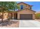 Inviting two-story home with a two car garage and covered porch, landscaped with a mature shade tree at 4051 E Torrey Pines E Ln, Chandler, AZ 85249
