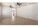 Expansive living room featuring tile flooring and easy access to staircase at 4051 E Torrey Pines E Ln, Chandler, AZ 85249