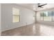 Bright living room featuring tile flooring, ceiling fan, and large windows at 4051 E Torrey Pines E Ln, Chandler, AZ 85249