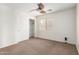 Bedroom with carpet, a ceiling fan, and a window providing natural light at 43581 W Mccord Dr, Maricopa, AZ 85138