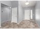 Bright entryway with tiled floors, neutral gray paint, and multiple doors at 43581 W Mccord Dr, Maricopa, AZ 85138