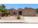 Inviting single-story home with xeriscape front yard, mature landscaping, and a convenient two-car garage at 43581 W Mccord Dr, Maricopa, AZ 85138
