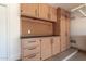 Garage featuring built in storage shelves and peg board, perfect for organization at 43581 W Mccord Dr, Maricopa, AZ 85138