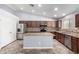 Kitchen featuring a center island, stainless steel appliances, and tile backsplash at 43581 W Mccord Dr, Maricopa, AZ 85138