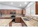 Kitchen with granite countertops, stainless steel appliances, and a double sink at 43581 W Mccord Dr, Maricopa, AZ 85138