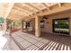 Covered patio with ceiling fan is perfect for outdoor dining and entertaining at 43581 W Mccord Dr, Maricopa, AZ 85138