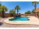 Outdoor pool with waterfall feature, perfect for hot Arizona summers, surrounded by desert landscaping at 43581 W Mccord Dr, Maricopa, AZ 85138