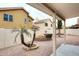 Relaxing backyard features desert landscaping, a fountain, privacy wall, and a covered patio at 4437 E Villa Theresa Dr, Phoenix, AZ 85032