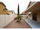 Backyard featuring desert landscaping, a fountain, and a covered patio at 4437 E Villa Theresa Dr, Phoenix, AZ 85032