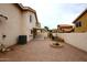 Backyard with desert landscaping, a fountain, and a covered patio attached to a two-story home at 4437 E Villa Theresa Dr, Phoenix, AZ 85032