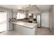 Bright kitchen boasts granite countertops, mosaic backsplash, stainless appliances, and eat in bar at 4437 E Villa Theresa Dr, Phoenix, AZ 85032