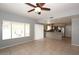 Spacious living room with natural light, tile floors, open layout, and modern gray paint at 4437 E Villa Theresa Dr, Phoenix, AZ 85032