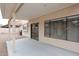 A covered patio offers a cool retreat, complete with concrete flooring and access to the home's interior at 4437 E Villa Theresa Dr, Phoenix, AZ 85032