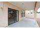 Covered patio area featuring sliding glass doors and neutral tones for relaxed outdoor living at 4437 E Villa Theresa Dr, Phoenix, AZ 85032