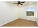 Bedroom with hardwood floors and a window bringing in natural light at 4611 E Fremont St, Phoenix, AZ 85042