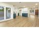 Open layout featuring a kitchen with modern cabinets and an adjacent living area with hardwood floors at 4611 E Fremont St, Phoenix, AZ 85042