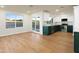 Open-concept kitchen showcasing sleek countertops, modern appliances, and hardwood floors at 4611 E Fremont St, Phoenix, AZ 85042