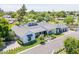 Aerial shot of a beautiful home with a lush green yard, an outdoor seating area and a basketball hoop at 4708 N 41St Pl, Phoenix, AZ 85018