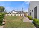 Expansive backyard with a well-maintained lawn and a brick pathway, perfect for outdoor activities at 4708 N 41St Pl, Phoenix, AZ 85018