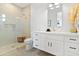 Modern bathroom featuring a glass-enclosed shower, white vanity, and stylish finishes at 4708 N 41St Pl, Phoenix, AZ 85018