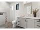 Well-lit bathroom with a walk-in shower, modern fixtures, and sleek white vanity at 4708 N 41St Pl, Phoenix, AZ 85018