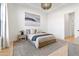 Bright bedroom featuring a modern bed, stylish rug, and large window overlooking a serene outdoor view at 4708 N 41St Pl, Phoenix, AZ 85018