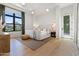 Bright bedroom features a large window, neutral decor, and wood flooring at 4708 N 41St Pl, Phoenix, AZ 85018