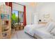 Bedroom featuring a decorative bookcase, bench with pillows, and natural light at 4708 N 41St Pl, Phoenix, AZ 85018