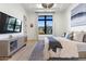 Bright bedroom featuring a modern bed, stylish rug, and large window overlooking a serene outdoor view at 4708 N 41St Pl, Phoenix, AZ 85018