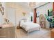 Bright bedroom showcasing unique safari themed wallpaper and stylish decor at 4708 N 41St Pl, Phoenix, AZ 85018