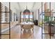 Elegant dining room with a large dining table, modern lighting, and a wine storage rack at 4708 N 41St Pl, Phoenix, AZ 85018