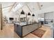 Open-concept kitchen with a large island, stainless steel appliances, and hardwood floors at 4708 N 41St Pl, Phoenix, AZ 85018