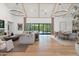 Open-concept living area with high ceilings, a fireplace, and seamless indoor-outdoor transition at 4708 N 41St Pl, Phoenix, AZ 85018