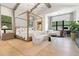 Sun-filled primary bedroom with wood flooring, large window and four-poster bed at 4708 N 41St Pl, Phoenix, AZ 85018